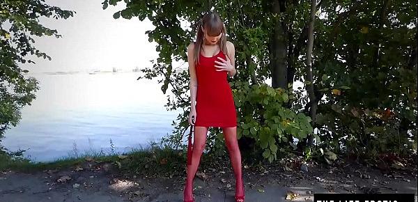  A really horny girl masturbating in the park pees on the sidewalk